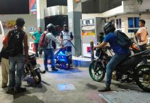 Motorcycle riders wait for their turn to refuel at a gas station in Pavia, Iloilo on Friday night, hours before another round of fuel price increase takes effect. PN PHOTO