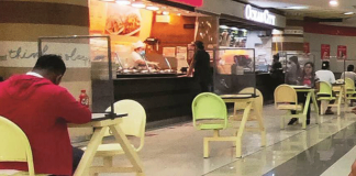 Every table in mall food court in Iloilo City has a plastic barrier to supposedly protect diners from coronavirus disease 2019. Plastic barriers also separate food kiosk cashiers from customers. PN PHOTO