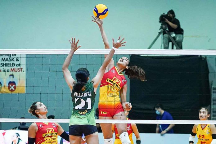 sports-F2-pic F2 Logistics’ middle blocker Mary Joy Baron flaunts her offensive skills by ripping Army’s single coverage put up by Jeanette Villareal. PVL MEDIA BUREAU