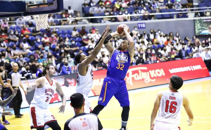 sports-Road-Warriors NLEX Road Warriors’ KJ McDaniels shoots over Barangay Ginebra San Miguel Kings’ Justin Brownlee. PBA PHOTO