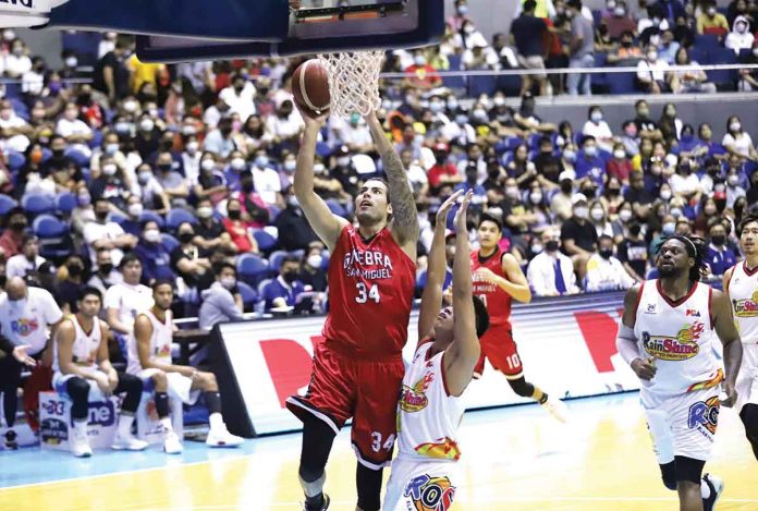 sports-ginebra Barangay Ginebra San Miguel Kings’ Christian Standhardinger easily scores against the defense of Rain or Shine Elasto Painters' Rey Nambatac. PBA MEDIA BURAU