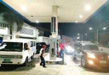 Vehicles in Iloilo City are waiting for their turn to refuel at a gas station on Monday night, hours before another round of fuel price increase will take effect. PN PHOTO