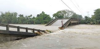 BRIDGE OVER TROUBLED WATERS. Residents of Dingle, Iloilo can’t cross to the other side of this river. The bridge straddling the river has collapsed due to the strong water current. The river swelled because of the heavy rains unleashed by Tropical Depression “Agaton” from April 10 to 12, 2022. PN PHOTO