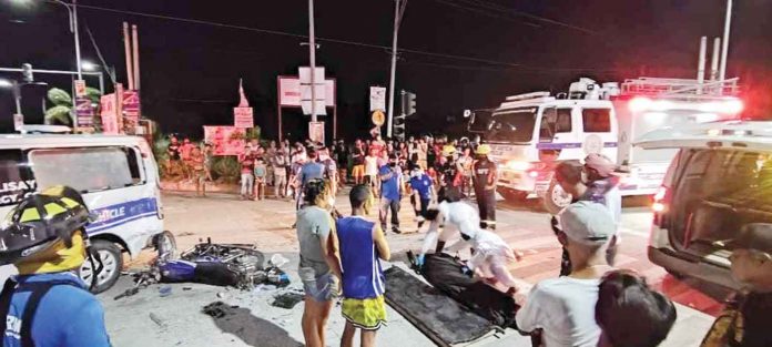 NIGHT ACCIDENT. Medics respond to a vehicular accident in Talisay City, Negros Occidental involving a speeding ambulance and a motorcycle. The motorcycle driver died. TALISAY CITY DRRMO PHOTO