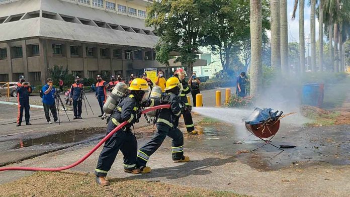 FIGHTING FIRE. These are women firefighters of the Bureau of Fire Protection based in Iloilo City. They are demonstrating their firefighting skills. Yesterday, the bureau capped its month-long observance of the Fire Prevention Month with a demo at Central Philippine Univesity. Women firefighters took center stage – the fire bureau’s way of recognizing March also as National Women’s Month. PHOTO BY GEOVANNI FAJARDO