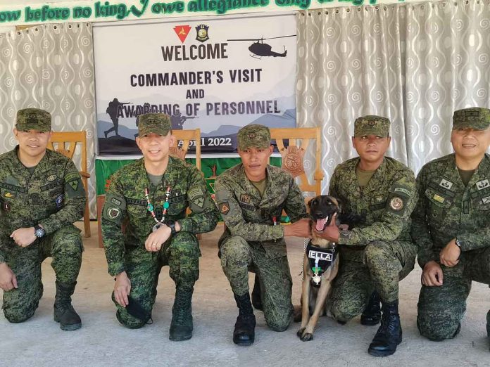K9 Ella, a Belgian Malinois, stands proud with his medal together with his team of Philippine Army soldiers based in Negros Occidental. PHOTO BY MARY JUDALINE FLORES PARTLOW