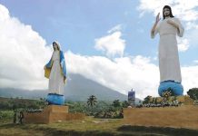 The giant cross and statues of Jess Christ and the Blessed Virgin Mary at Mandayao Panorama Park in Barangay Mansalanao in La Castellana, Negros Occidental.