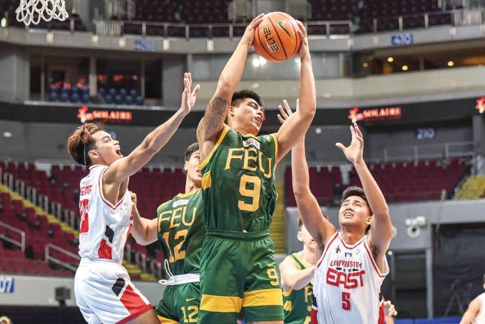 sports-ilonggo Ilonggo John Bryan Sajonia of Far Eastern University Tamaraws grabs the rebound while being surrounded by defenders. UAAP MEDIA BUREAU