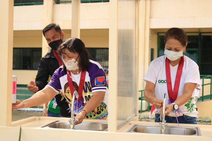 1 SYNERGY FOR THE SCHOOLS. Leading the turnover of the donated handwashing stations by CEDC and GTFI for the benefit of public school students of Toledo were (from right) Engr. Leah G. Diaz – GBP FVP for Cebu Operations; Mrs. Mae Tacandong, Admin Head of Toledo City; and Mr. Orlando Cadano, Assistant Schools Superintendent of DepEd – Division of Toledo City.