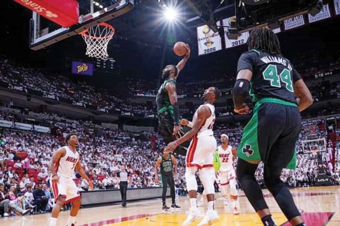Boston Celtics forward Jaylen Brown skies for a dunk. AP