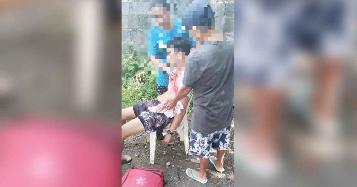 father-parricide Concerned neighbors restrain a disoriented father after killing his son in Barangay Bubog, Numancia, Aklan. PHOTO BY THE NUMANCIA MDRRMO