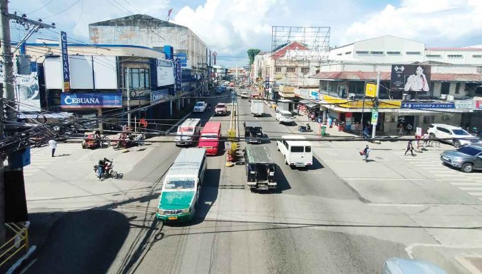 front-pic To improve the transport service and mobility in Iloilo City, the Local Public Transport Route Plan will be enforced this June after months of planning. Thirteen new routes will be opened to be serviced by modernized jeepneys. But there’s a catch: provincial jeepneys will no longer be allowed to enter the city. Photo shows Iznart Street, one of the city’s major thoroughfares. PN PHOTO