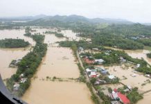 Floodwaters engulf this vast area of Capiz, in this photo taken by the Office of Civil Defense Region 6 last month after Tropical Depression “Agaton” pounded the province with torrential rains. OCD-6 PHOTO