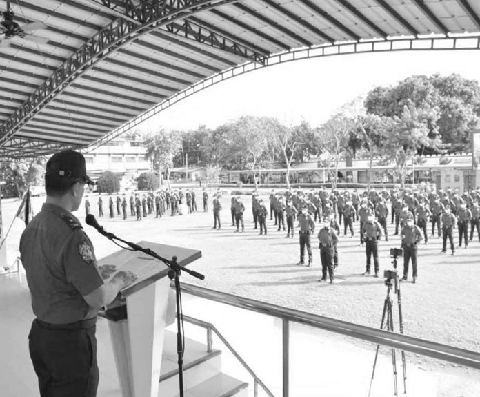 “You delivered beyond what is expected from you during deployment, from acting as precinct finders, navigators and even nannies to the children of would-be voters. You remained true to your duty,” Police Regional Office 6 director, Police Brigadier General Flynn Dongbo, tells policemen in Camp Delgado, Iloilo City. PRO-6 PHOTO