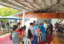 People gather at a vaccination site against coronavirus disease in Aklan.