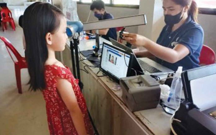 A young girl prepares for her Philippine Identification System (PhilSys) identification card photo in this undated photo. Mobile teams have been deployed to reach out to residents that need to be registered with PhilSys. PNA FILE PHOTO BY PGLENA