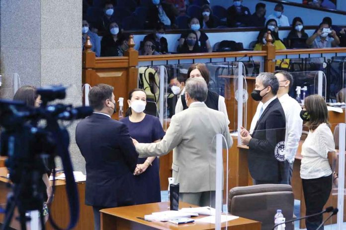 senators Senators huddle during a break of their session tackling MORE Electric and Power Corporation’s franchise expansion bill. In photo are senators Juan Miguel Zubiri, Grace Poe, Tito Sotto, Pia Cayetano, Joel Villanueva, Nancy Binay, and Sonny Angara. PHOTO FROM SEN. GRACE POE’S FACEBOOK PAGE
