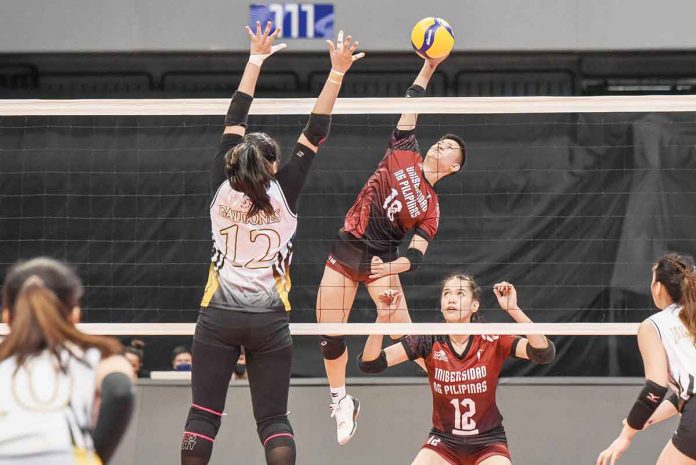 sports-UP Negrense Alyssa Bertolano of the University of the Philippines Fighting Maroons attempts to score against the defense of University of Santo Tomas Golden Tigresses’ Kecelyn Galdones. UAAP MEDIA BUREAU
