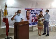 Councilor Candice Magdalane Tupas of Iloilo City takes her oath of office before Barangay Captain Sergio Causing of Mandurriao district. With Tupas is her husband, former councilor Nielex Tupas. PHOTO FROM THE FB PAGE OF COUNCILOR CANDICE MAGDALANE TUPAS