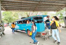 Passengers disembark from a provincial jeepney at the transport terminal in Barangay Ungka, Jaro, Iloilo City. To enter they city they must transfer to a city loop jeepney. PN PHOTO