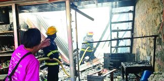 This is what’s left of a stall – one of 20 – that fire razed in Tigbauan, Iloilo. Firefighters conduct a mop-up operation. ARNEL JOHN PALCULLO/PN