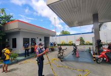 Gas station loses P1.6M to robbers A policeman is securing this robbed gasoline station in Jaro district with a yellow tape. The area is considered a crime scene. PHOTOS FROM ARNEL JOHN PALCULLO/PN