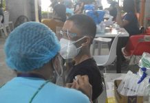 A teenager gets his shot of the vaccine against coronavirus disease at a vaccination center in Iloilo City. For children between 12 to 17 years old in the metro, the vaccination is high at 94.88 percent of the 51,580 target population. PN PHOTO