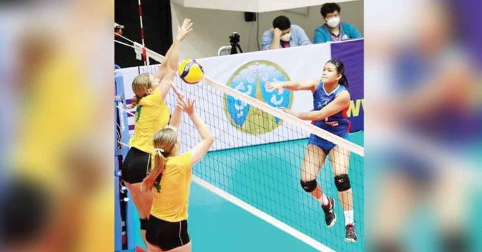 pinay-aussies Team Philippines’ Jothea Ramos slams the ball against the defense of Australia. PHOTO COURTESY OF AVC