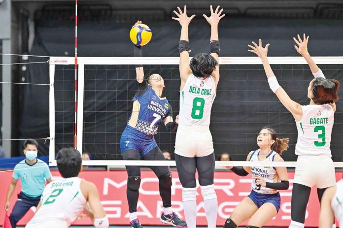 Ilongga Princess Anne Robles of the National University Lady Bulldogs with an attack against the defense of De La Salle University Lady Spikers. UAAP MEDIA BUREAU