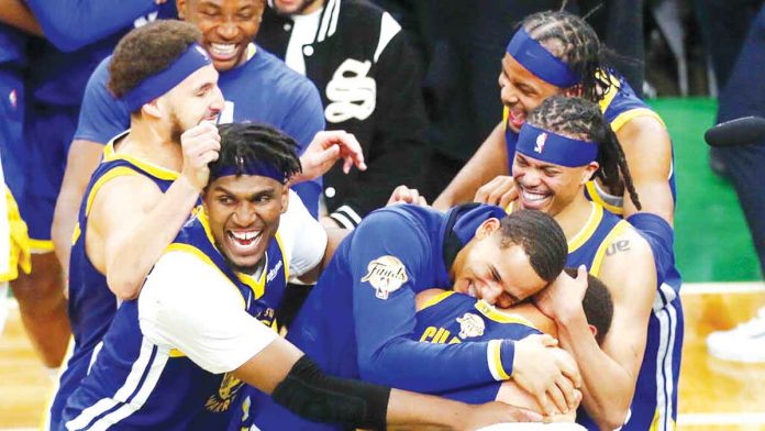 sports-golden The Warriors are emotional after winning their first title since 2018. AP