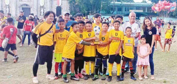 sports-tamasak Tamasak Football Club coach Francisco De Asis (leftmost) and his players celebrate after winning the Mayor Bryant Paul Q. Biron Football Festival Under-12 category crown on Thursday, June 9, 2022. CONTRIBUTED PHOTO