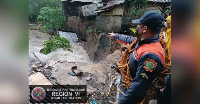bfp-ivisan A house fell into the river and was swept away by the flood after the land on which it was standing collapsed due to heavy rains all day in Barangay Ilaya-Ivisan in Ivisan, Capiz on July 10, Sunday afternoon. BFP Ivisan