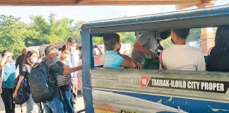 MASKED PASSENGERS. People from Iloilo province board an Iloilo City-bound jeepney at the transport terminal in Barangay Tagbak, Jaro district. The provincial government of Iloilo says it is not yet the time to do away with facemasks, citing the surge in coronarivus disease cases in the province. ARNEL JOHN PALCULLO/PN
