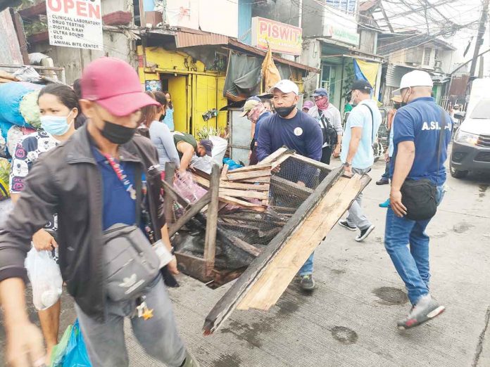 front-pic ROAD CLEARING. Obstructions are being removed from this street in Iloilo City. The Department of Interior and Local Government urges local government units to continue the nationwide road clearing operations. The goal is to make roads safe spaces. ARNEL PALCULLO/PN