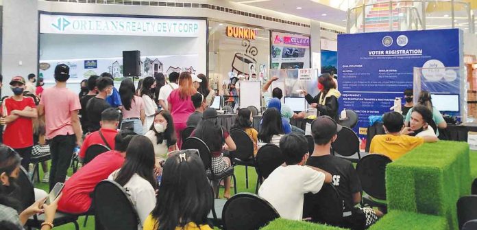 mall Eligible people young and old in Roxas City gather at a mall for voters’ registration so they could vote in the Dec. 5, 2022 barangay and Sangguniang Kabataan elections. PIA-CAPIZ PHOTO