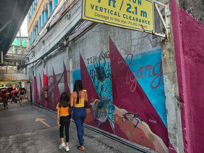 murals-climate-change These murals on Delgado Street, Iloilo City are by a collective of artists, social innovators and unconventional movers working to bring engaging collaborative art to the heart of communities and unlikely locations. ARNEL JOHN PALCULLO/PN