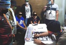 2 nabbed in P1.1M ‘shabu’ buy-bust Police operatives inventory the items recovered in a buy-bust operation in Jaro, Iloilo City as the two arrested suspects look on. PRO-6 PHOTO