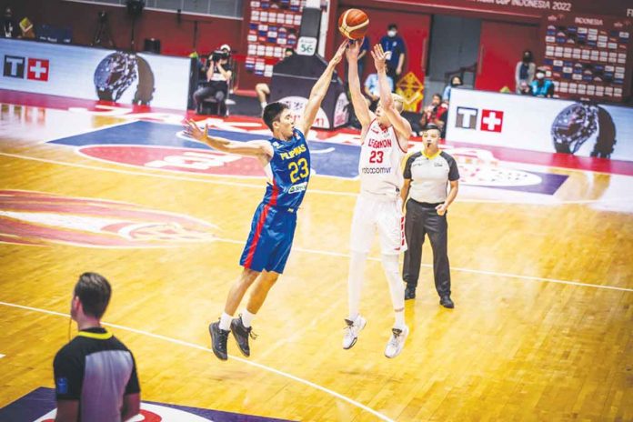 Gilas Pilipinas’ William Navarro foils the three-point attempt of Lebanon’s Yousef Khayat. FIBA PHOTO