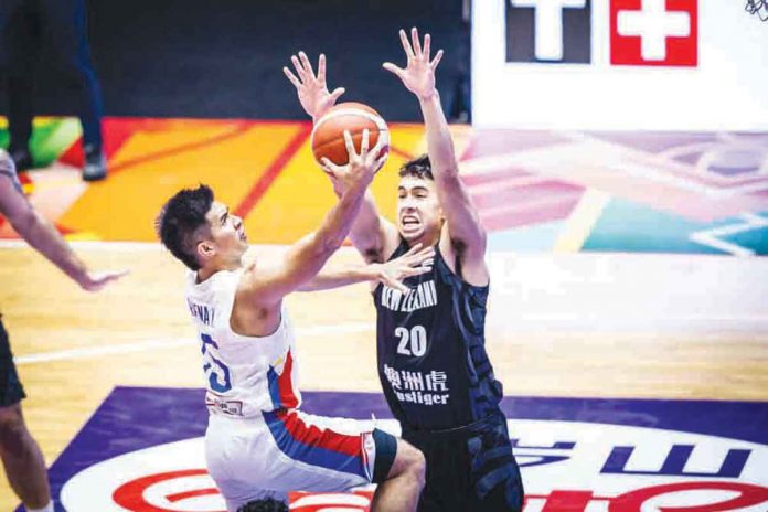 sports-gilas Ilonggo Kiefer Ravena of Gilas Pilipinas attacks the defense of New Zealand’s Takiula Fahrensohn for a layup. FIBA PHOTO
