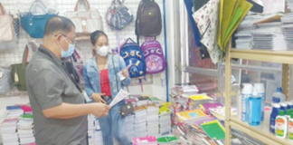 Trade and Industry Development Specialist Glen Fernando monitors the prices of school supplies in a store in San Jose, Antique. PHOTO COURTESY OF DTI-ANTIQUE