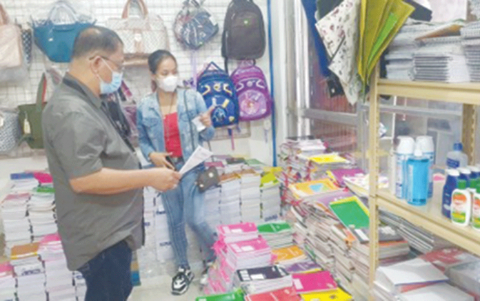 biz-supply Trade and Industry Development Specialist Glen Fernando monitors the prices of school supplies in a store in San Jose, Antique. PHOTO COURTESY OF DTI-ANTIQUE