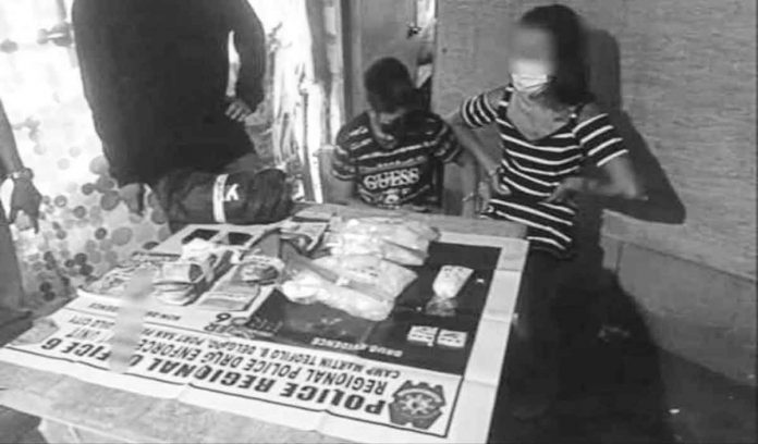 news-dom-sisters Handcuffed drug suspects sisters Angie and Angielyn ponder their fate after their arrest in Silay City, Negros Occidental.