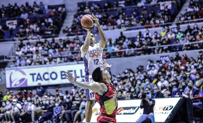 sports-TNT-pic-and-caption TNT Tropang Giga pulls up for the game-winning basket against the defense of San Miguel Beermen’s Simon Enciso. PNA MEDIA BUREAU