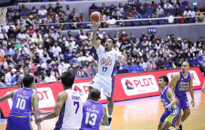 sports-TNT-pic-and-caption TNT Tropang Giga’s Jayson Castro floats in the air for a conversion. PBA MEDIA BUREAU