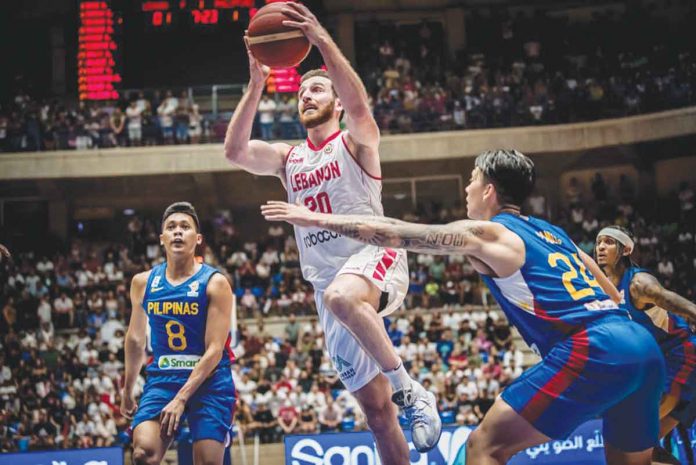 sports-arakji Lebanon’s Wael Arakji attacks the basket as the Philippines’ Dwight Ramos tries to defend. FIBA PHOTO
