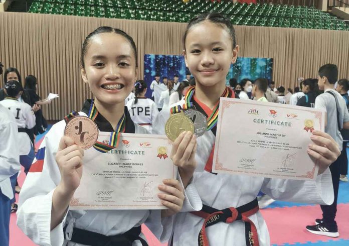 Ilonggas Elizabeth Marie Borres and Julianna Martha Uy are all smiles with their medal finishes in the poomsae event of the 2022 Asian Cadet, Junior, & Para Open Taekwondo Championships. PHOTO COURTESY OF FLORA NAVALES