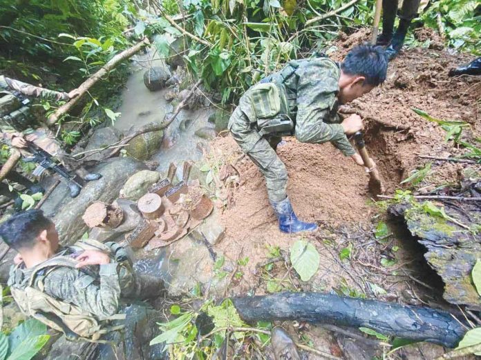 army Soldiers of the Philippine Army's 94th Infantry Battalion recover almost 2,000 live rounds of ammunition, two anti-tank mines, eight anti-personnel mines, and 10 improvised explosive devices from an alleged ammunition dump of the New People’s Army in Himamaylan City, Negros Occidental. 94IB PHOTO