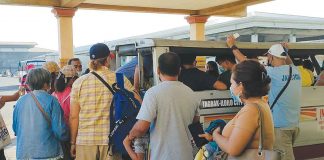 Passengers queue to board an Iloilo City-bound jeepney at the transport terminal in Barangay Tagbak, Jaro district. Next week, they would be paying more for their fare. Jeepney fares “are due for an increase already,” according to the Land Transportation Franchising and Regulatory Board. ARNEL JOHN PALCULLO/PN