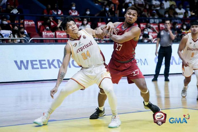 sports-Lyceum-pic-and-caption Ilonggo Omar Larupay of Lyceum of the Philippines Pirates (27) battles with University of Perpetual Help Altas’ Lean Martel (24) during their NCAA Season 98 men’s basketball game. PHOTO BY NCAA/GMA