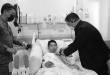 Army identifies casualties in Himamaylan clash Department of National Defense officer-in-charge Undersecretary Jose Faustino Jr. awards the Wounded Personnel Medal to a soldier of the Philippine Army’s 94th Infantry Battalion confined at a hospital in Bacolod City during his visit to Negros Occidental on Sunday, Oct. 9, 2022, with Brigadier General Inocencio Pasaporte (left), commander of 303rd Infantry Brigade. The troops engaged New People’s Army rebels in a series of encounters from Oct. 6 to 8 in the hinterlands of Himamaylan City that also claimed the lives of two soldiers and displaced thousands of families in the affected villages. 303RD INFANTRY BRIGADE, PHILIPPINE ARMY PHOTO